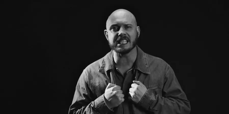 Box of Rules: black-and-white portrait, fists gripping jacket